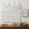 White triangular calacatta gold mosaic marble tile wall featuring tumbled hexagon design for elegant surfaces