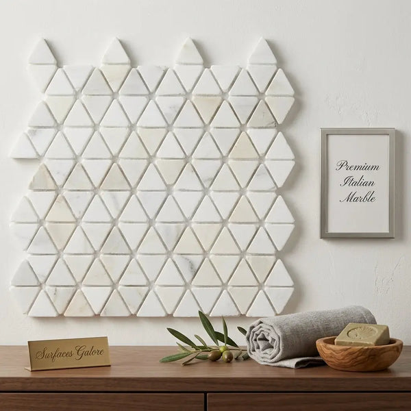 White triangular calacatta gold mosaic marble tile wall featuring tumbled hexagon design for elegant surfaces