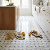 Calacatta gold triple-weave polished italian marble tile in white and gray with classic herringbone pattern