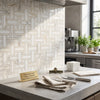 Calacatta gold triple-weave mosaic marble tile with a white and gold veined basketweave backsplash design