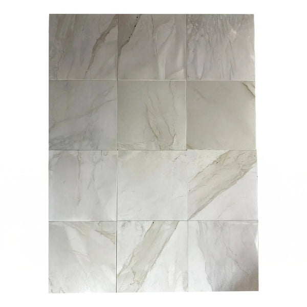 Rectangular arrangement of Calacatta Gray polished marble tiles on display