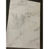 White marble-patterned tiles from Calacatta Oliva Marble 12X24 collection