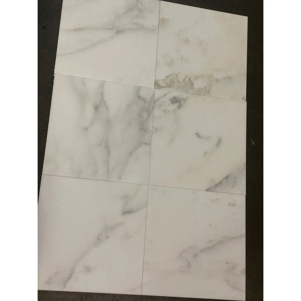 White marble-patterned tiles from Calacatta Oliva Marble 12X24 collection