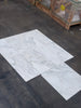 White marble-look porcelain tiles with grey veining from Calacatta Oliva Marble collection