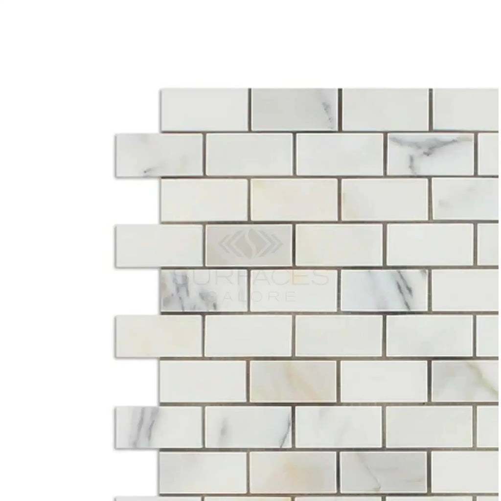 Calacatta Oliva Marble 1x2 Brick Mosaic Tile in polished white marble design