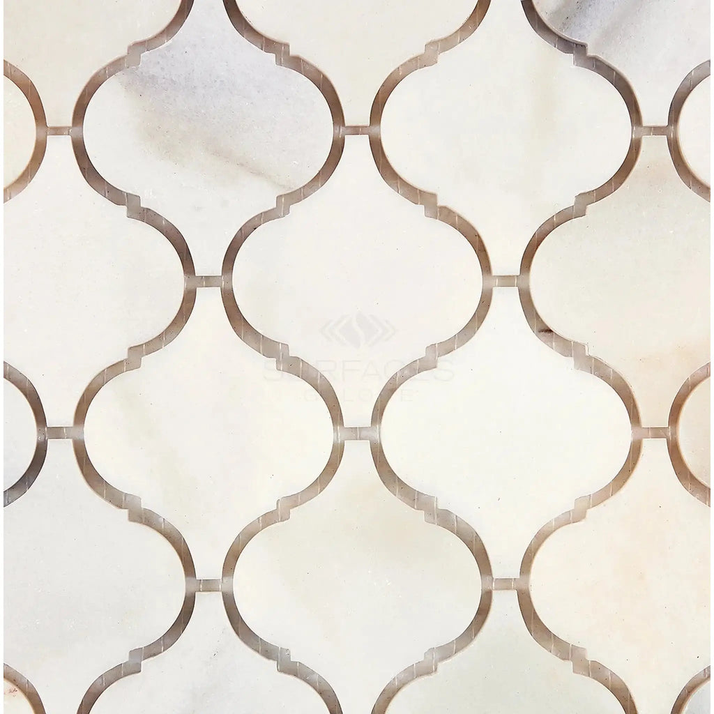White marble tile pattern featuring Calacatta Oliva 3 inch Lantern mosaic design