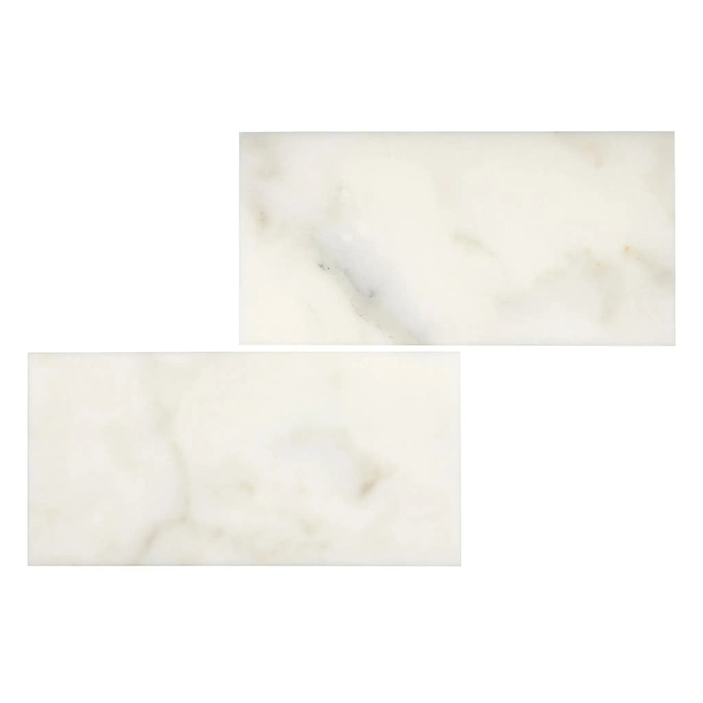 Two rectangular Calacatta Oliva Marble 3X6 Deep-Beveled Polished-Honed tiles