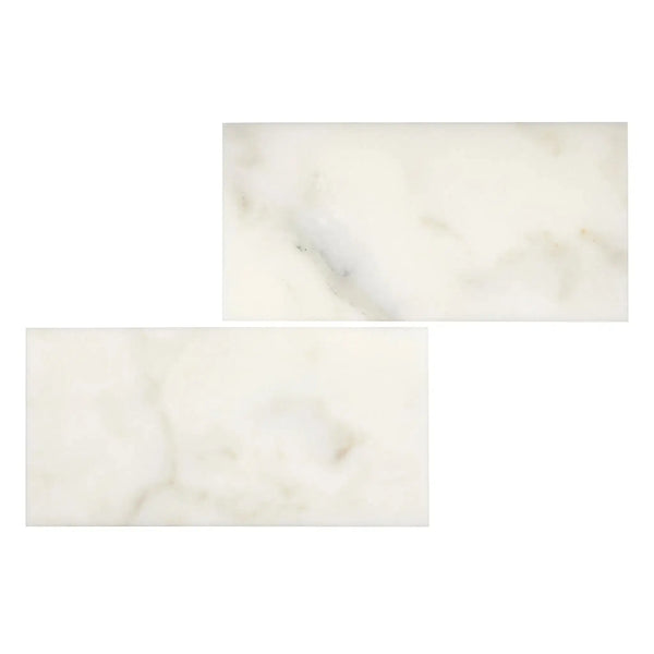 Two rectangular Calacatta Oliva Marble 3X6 Deep-Beveled Polished-Honed tiles