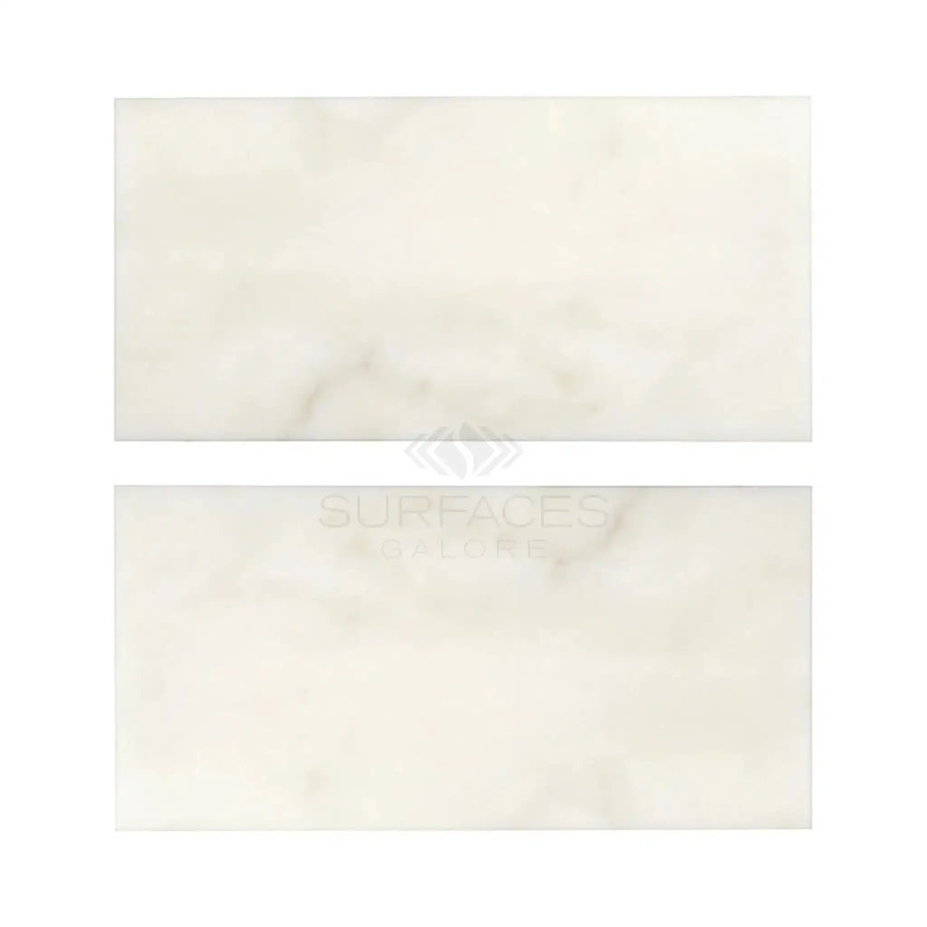Two rectangular white Calacatta Oliva Marble 3X6 tiles polished or honed