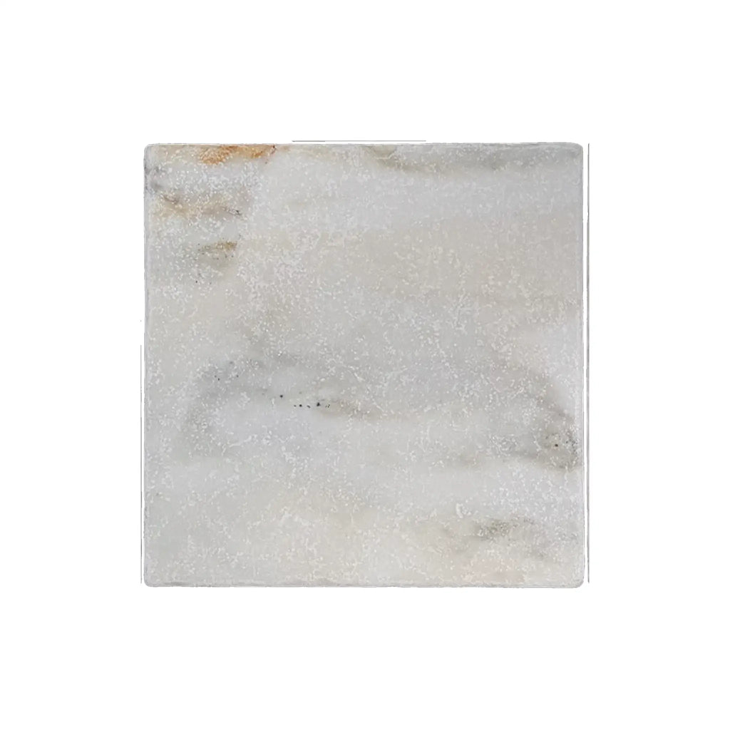A square white calacatta verde royale marble 12x12 tile coaster with subtle gray veining and a textured surface