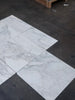 White rectangular Calacatta Oliva Marble tiles with grey veining in polished or honed finish