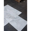 White marble tiles with grey veining from Calacatta Oliva Marble 18x18 collection