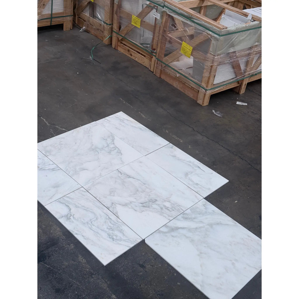 White marble-look tiles with gray veining from Calacatta Oliva Marble 18X18 Tile collection