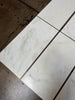 Calacatta Oliva Marble 18x36 Polished Tile with Black Grout