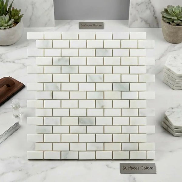 Calacatta verde royale marble 1x2 brick mosaic tile polished with white marble subway tiles and subtle gray veining