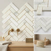 Calacatta verde royale marble 1x3 polished herringbone mosaic tile with white and gray veining in a herringbone pattern