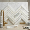 Calacatta verde royale marble 1x6 polished white marble tiles arranged in a herringbone mosaic pattern