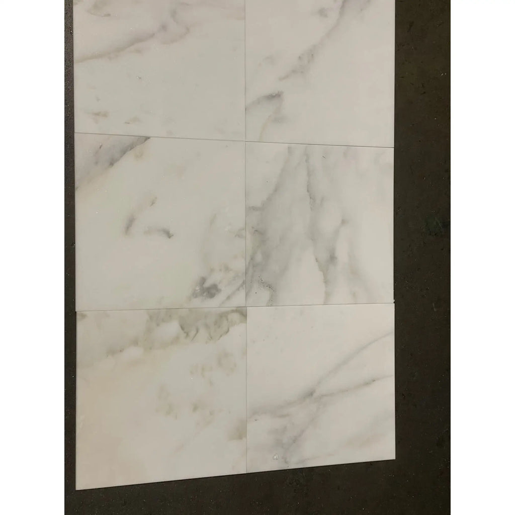 White marble-patterned tiles from Calacatta Oliva Marble 24X24 Tile collection, polished or honed finish