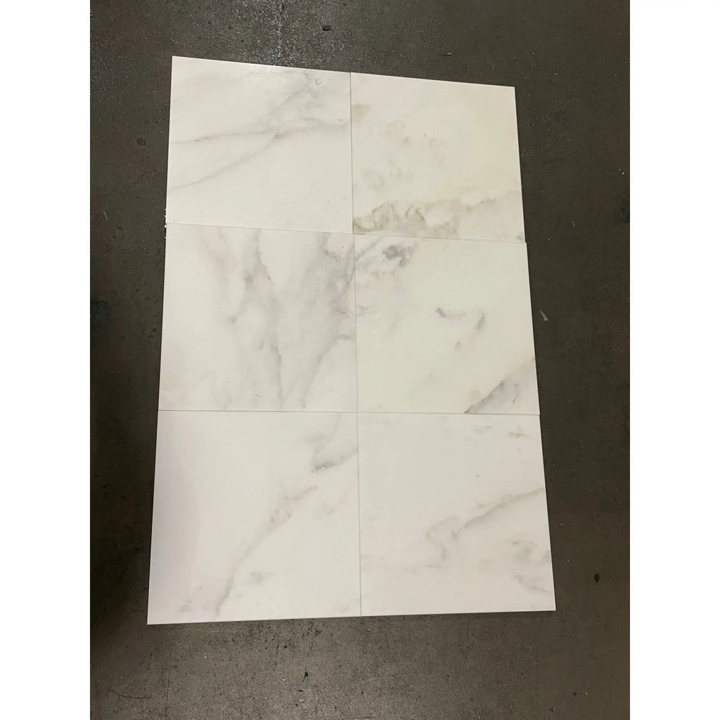 White marble-patterned tiles from Calacatta Oliva Marble 24X24 Tile collection