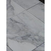 White marble-look floor tiles with grey veining from Calacatta Oliva Marble 24X24 collection