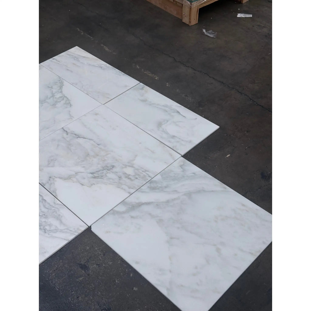 White marble tiles with gray veining from Calacatta Oliva Marble 24X24 collection