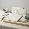 Calacatta Verde Royale Marble 3x6 deep-beveled tile polished-honed white marble with subtle gray veining on wooden tray