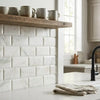 Calacatta verde royale marble 3x6 deep-beveled tile in polished-honed white marble effect with subtle gray veining