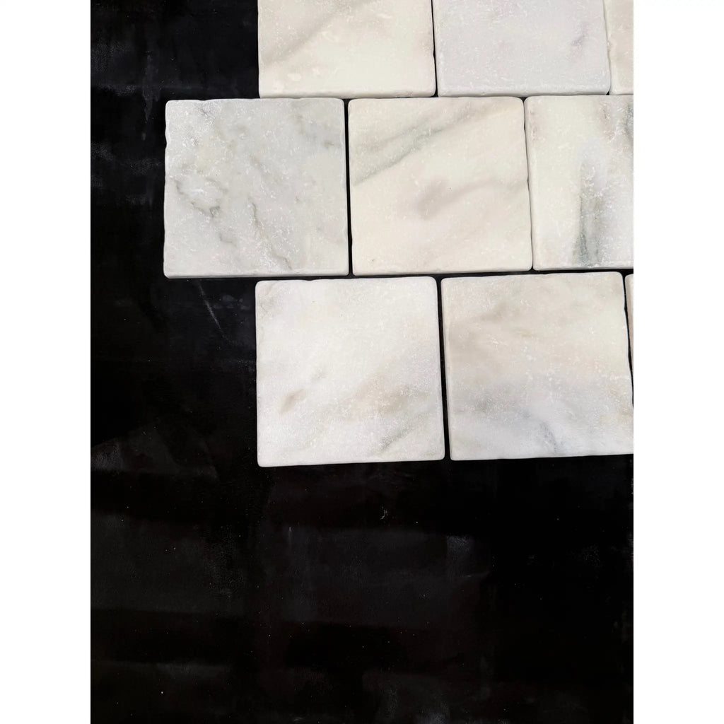 Square white calacatta verde royale marble 4x4 tile with subtle gray veining arranged in a mosaic pattern