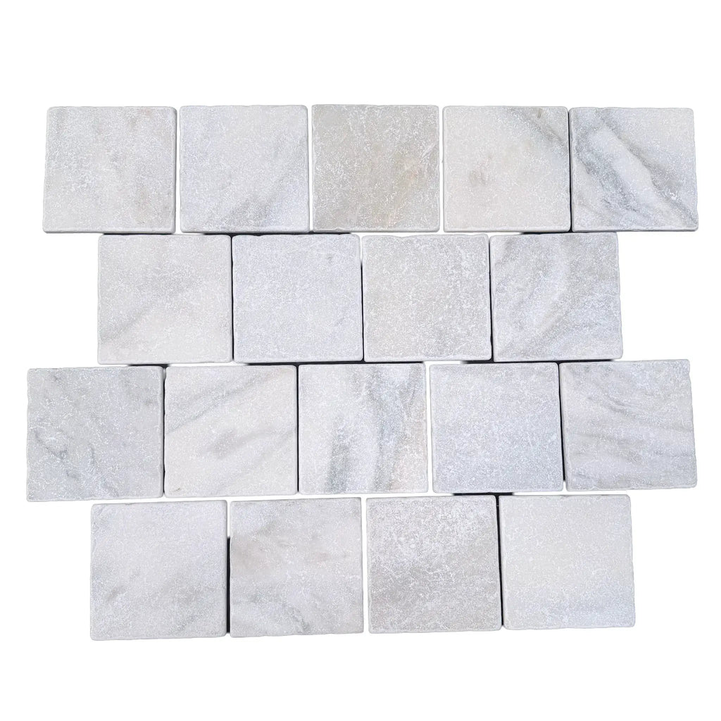 Calacatta verde royale marble 4x4 tile tumbled featuring white marble mosaic tiles with subtle gray veining in staggered pattern