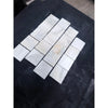 Calacatta verde royale marble 4x4 tile tumbled white marble with subtle gray veining in a mosaic pattern