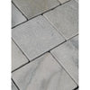 Calacatta verde royale marble 6x6 tile tumbled with gray stone pavers and a textured slightly uneven surface