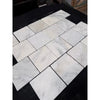 Calacatta verde royale marble 6x6 tile tumbled white marble with subtle gray veining in a herringbone pattern