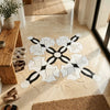 Calacatta verde royale marble floral mosaic tile floor featuring an intricate white and black marble floral pattern on beige background
