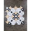 Calacatta Verde Royale marble floral mosaic tile with symmetrical white black and beige marble pieces in intricate pattern