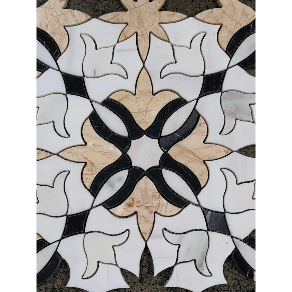 An elegant calacatta verde royale marble floral mosaic floor featuring symmetrical white black and beige marble tiles