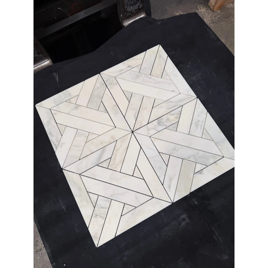 Calacatta Verde Royale marble mosaic tile in white with a geometric herringbone polished-honed pattern