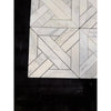 Calacatta verde royale marble heritage pattern mosaic tile in white marble with geometric herringbone design and dark grout lines