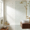 Calacatta verde royale white marble mosaic tile with subtle veining in interlocking herringbone polished pattern