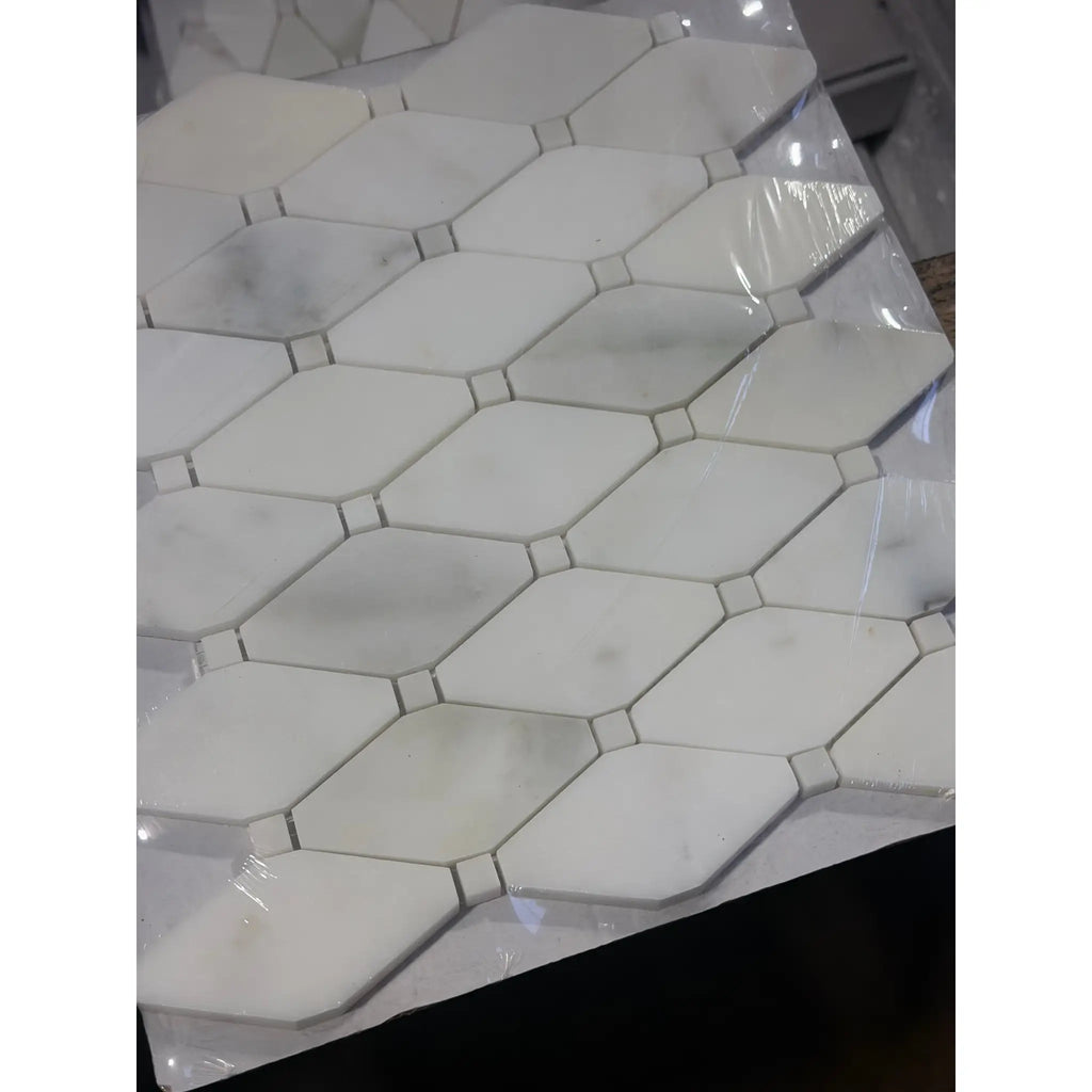 Calacatta Verde Royale polished octagon marble tile with black grout