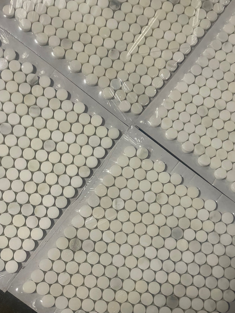 White penny round mosaic tiles packaged in sheets for Calacatta Oliva Marble Mosaic application