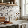Gold-toned gooseneck faucet with sleek modern design paired with Calacatta Viola 2 inch hexagon polished or honed tile