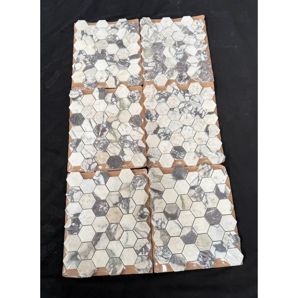 Calacatta viola 2 inch hexagon polished white and gray marble mosaic tiles arranged in four rectangular panels