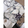 Calacatta Viola Imperiale marble slabs in white and dark gray with natural veined pattern, 12x24 polished-honed