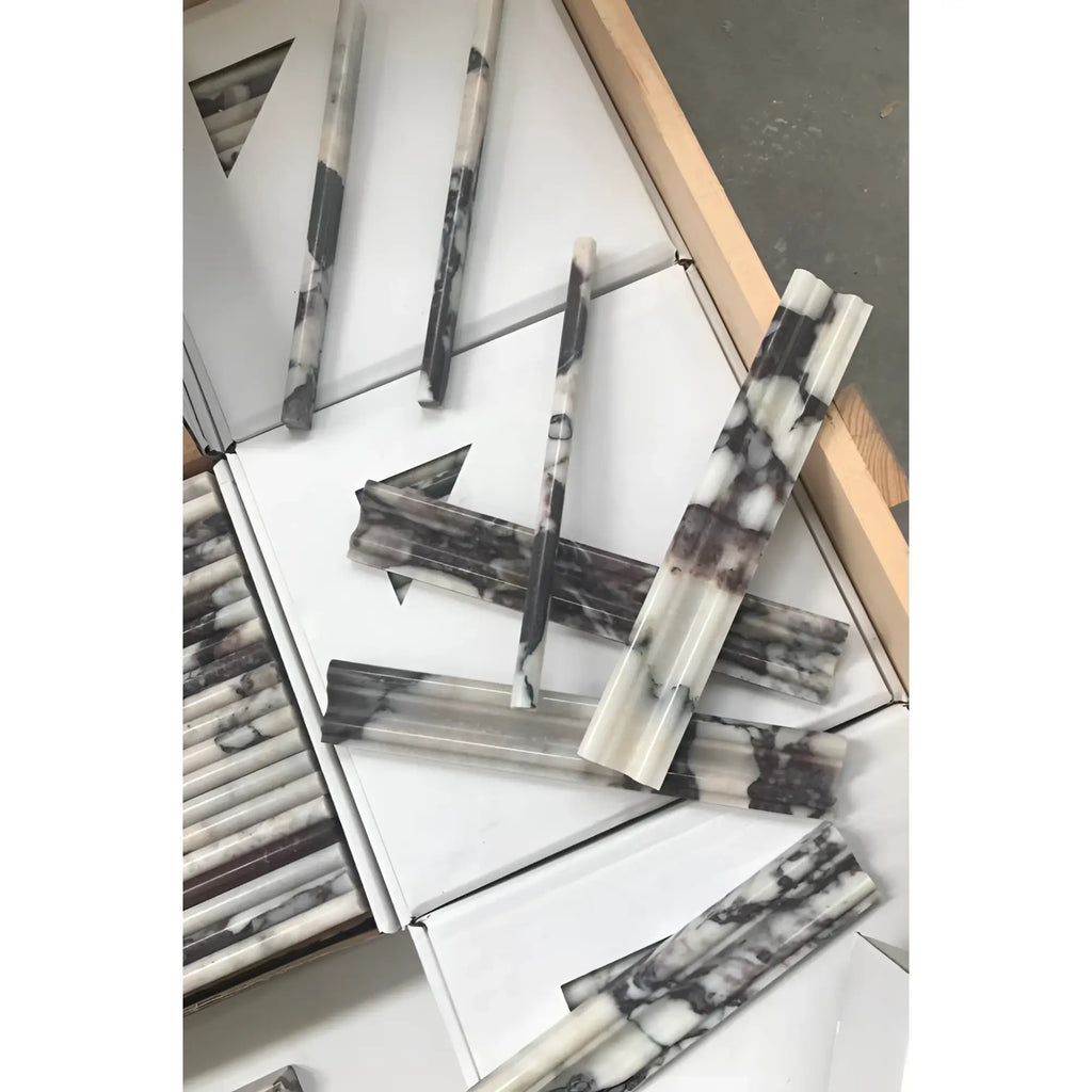 Calacatta Viola Imperiale marble 2x12 chair rail trim in display box