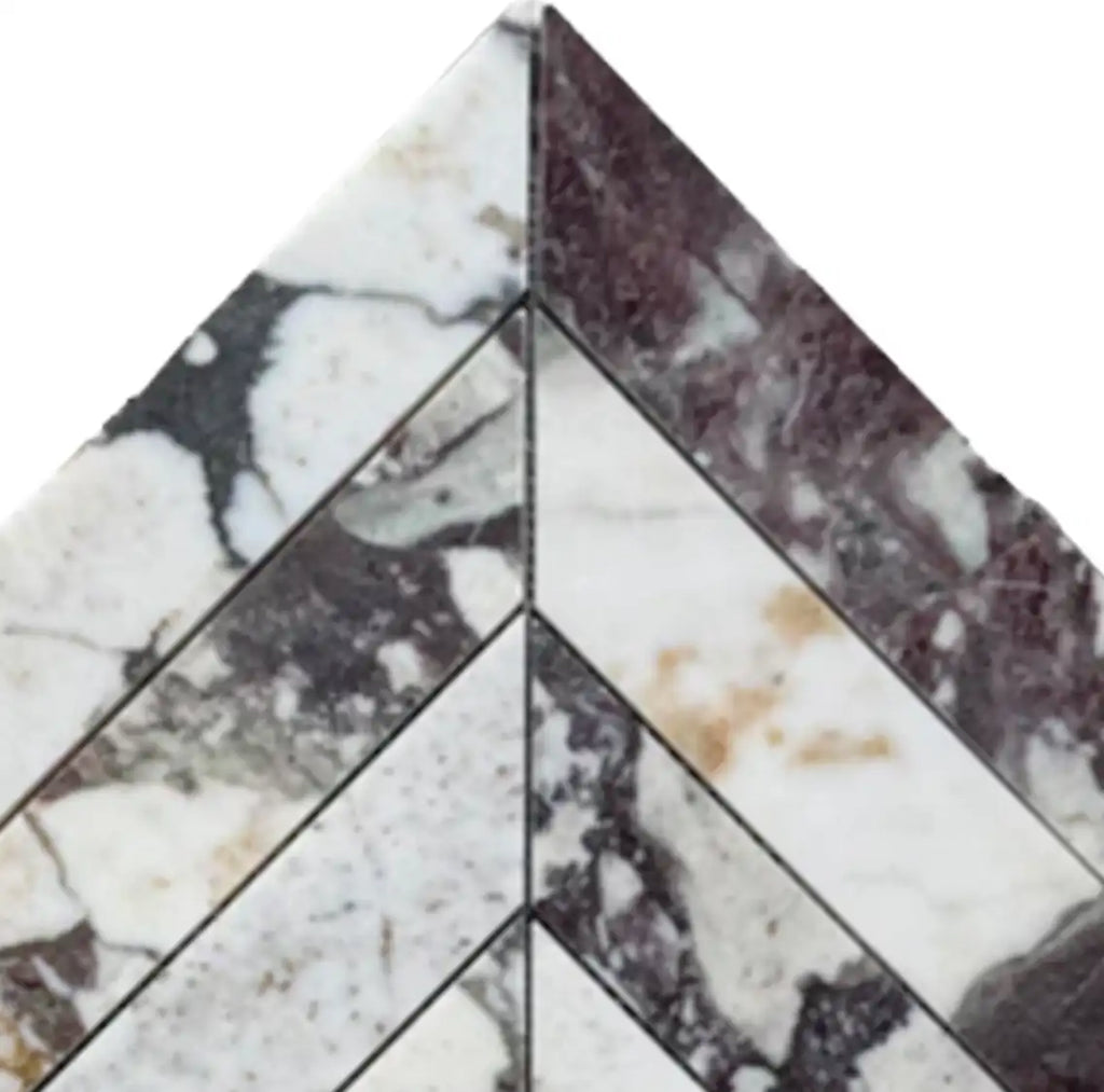 Calacatta Viola Imperiale marble 2x8 chevron mosaic with veining and gold accents