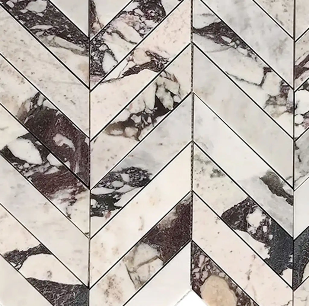 Calacatta Viola Imperiale marble 2x8 chevron mosaic in herringbone pattern with white and dark veining, polished-honed