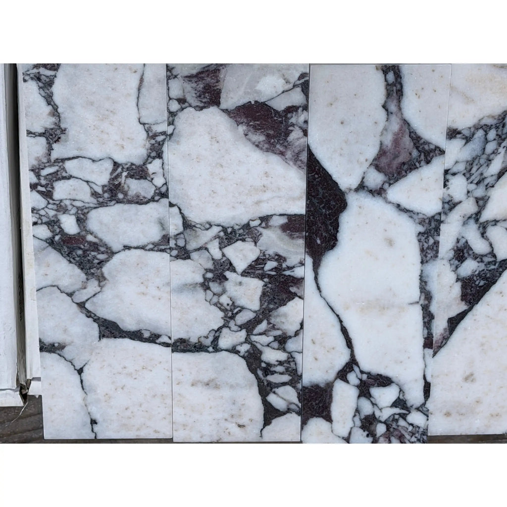 Calacatta Viola Imperiale marble hexagon mosaic with white slabs and black veining