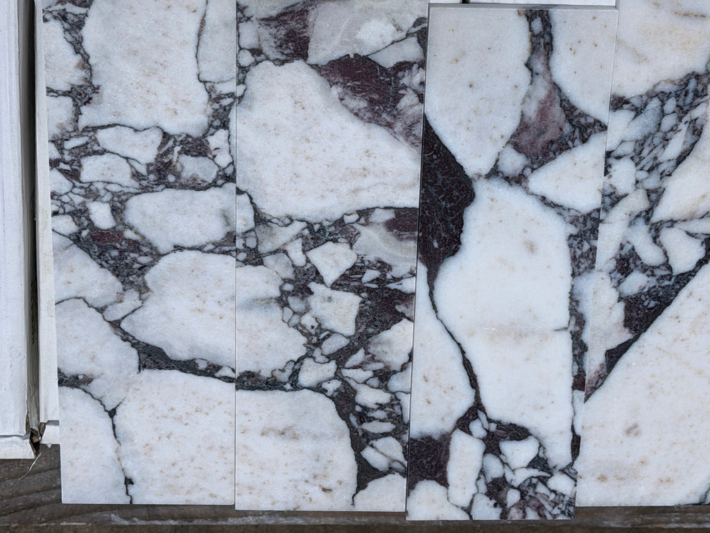 Calacatta Viola Imperiale marble 3-inch hexagon mosaic with white slabs, black and purple veining