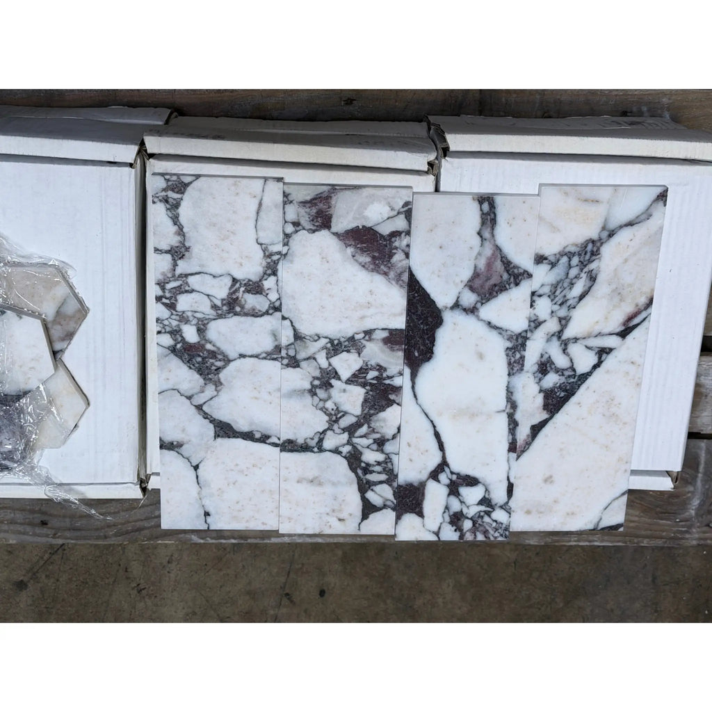 Calacatta Viola Imperiale Marble 4x12 Polished-Honed tiles with white marble, black and gray veining in vertical strips