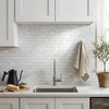Carrara white brick mosaic marble tile polished with white subway tile backsplash featuring subtle gray veining